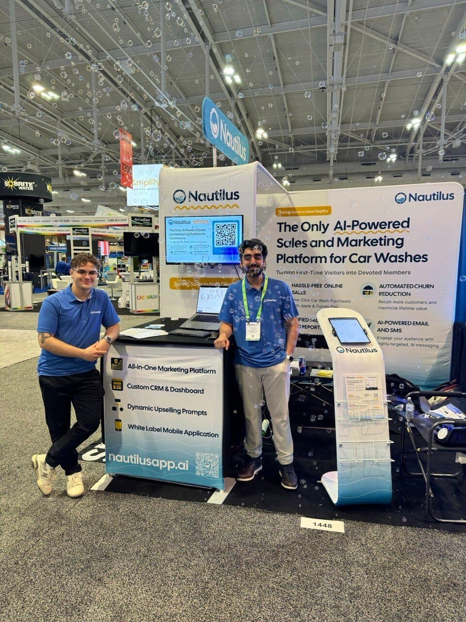 Nautilus co-founders Ali and Amayr at the Nautilus booth during a car wash industry trade show